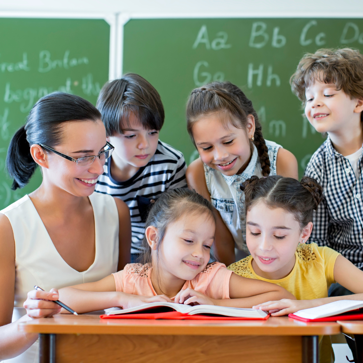 Special education teacher supporting a neurodiverse student in an inclusive classroom
