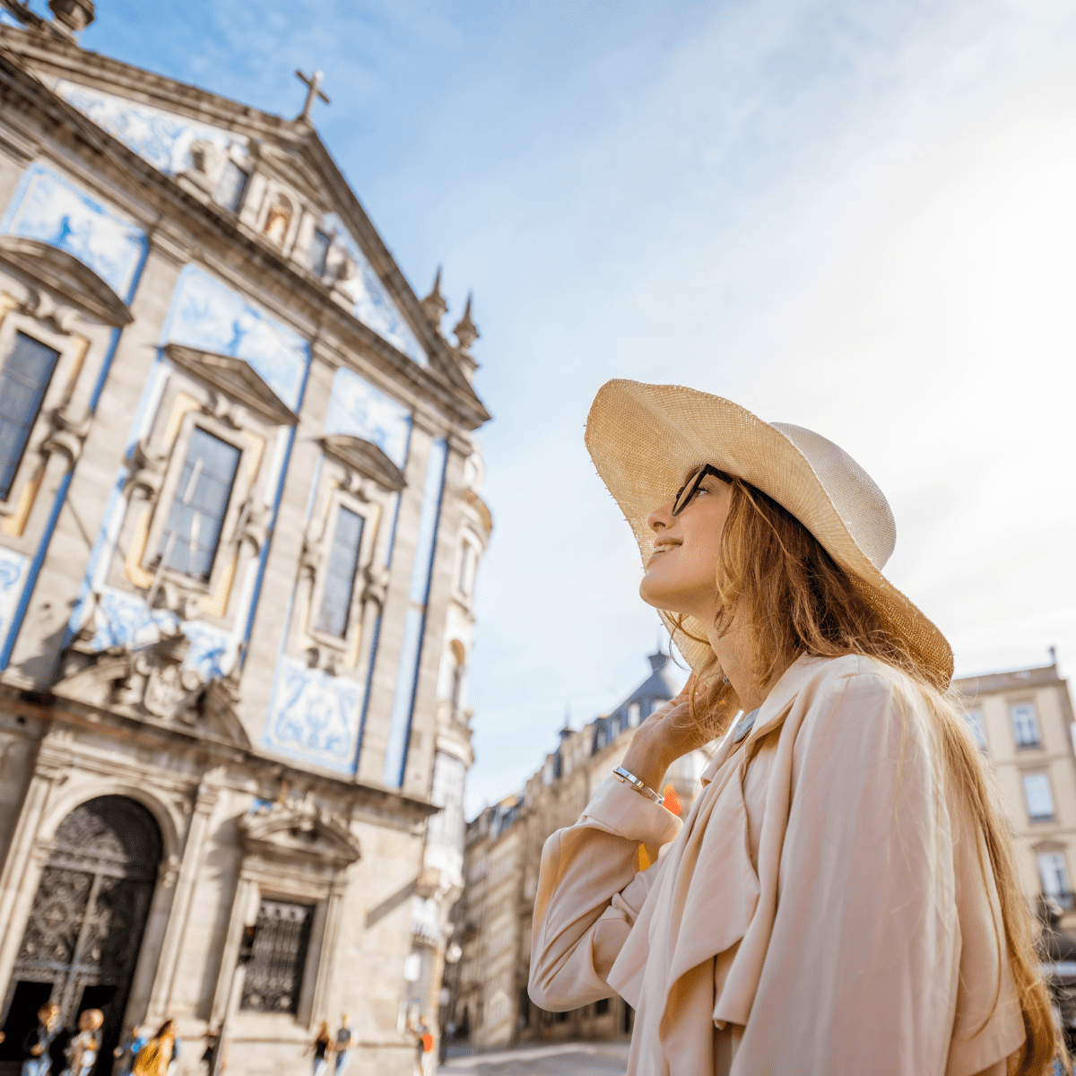 A woman enjoying travel therapy while exploring a historic European cathedral.