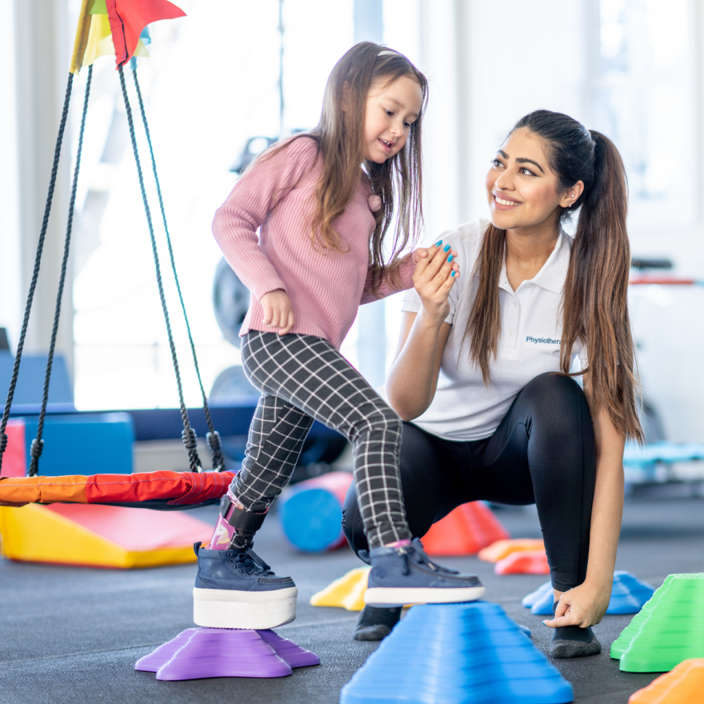 A young girl practicing balance on colorful blocks during a Pioneer pediatric travel therapy session.